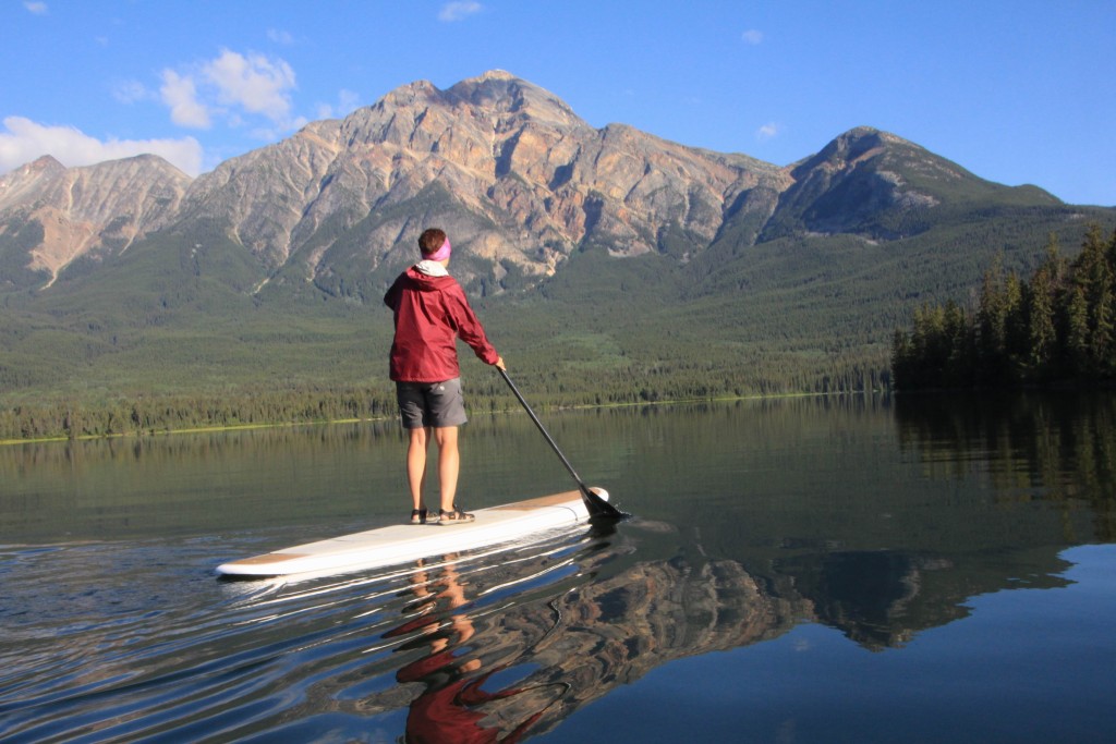 person on stand up paddleboard in Canadian Rockies