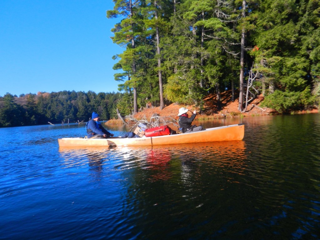 Canoeing Upper Peninsula Michigan: man and woman paddling on lake