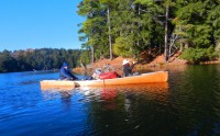 Canoeing Upper Peninsula Michigan: man and woman paddling on lake